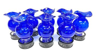 cobalt vase awards on round wood bases with plaques