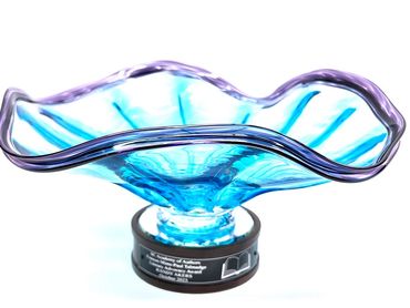 double lipped blown glass flared bowl with round wood base and plaque