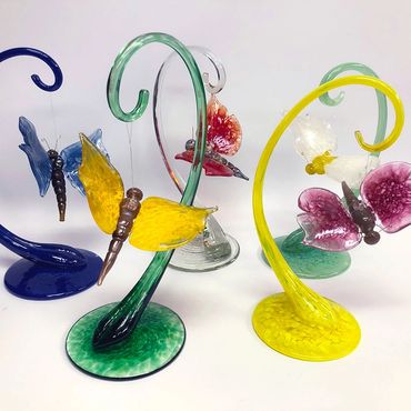blown glass butterflies on stands