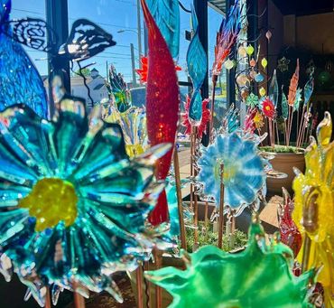 outdoor blown glass pinwheel flowers and feathers
