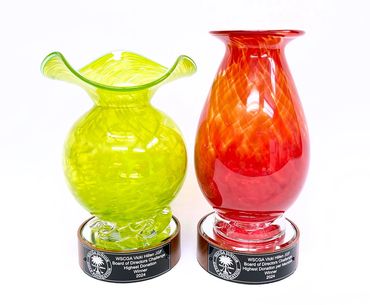 blown glass vase awards on round wood bases with plaques