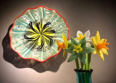 blown glass wall platter and daffodils