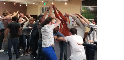 A group of people playing advanced improv games