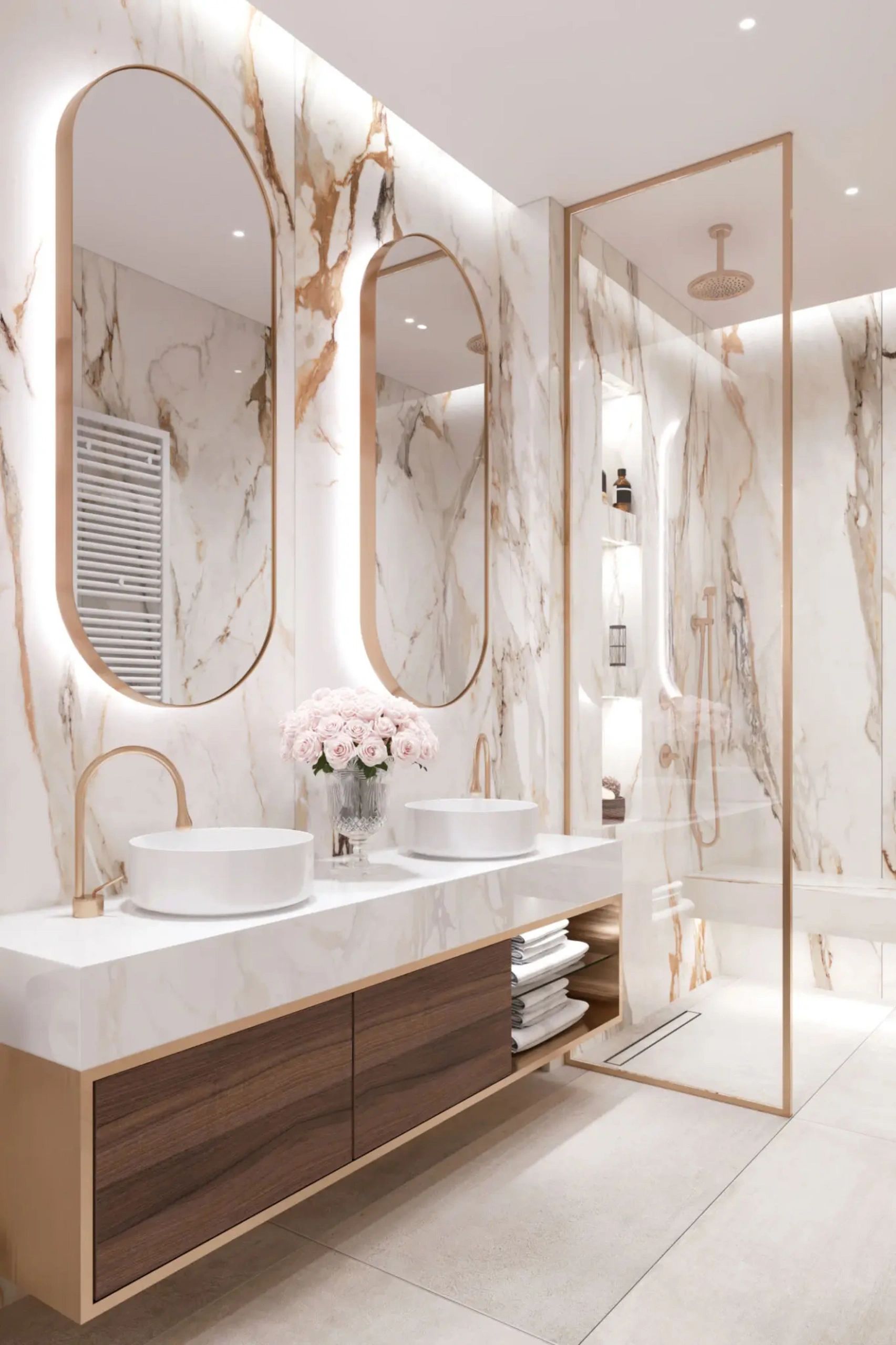 Contemporary primary bathroom wtih white marble his and her sinks, modern gold finishings.