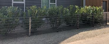 Metal fence with thin metal crossbars