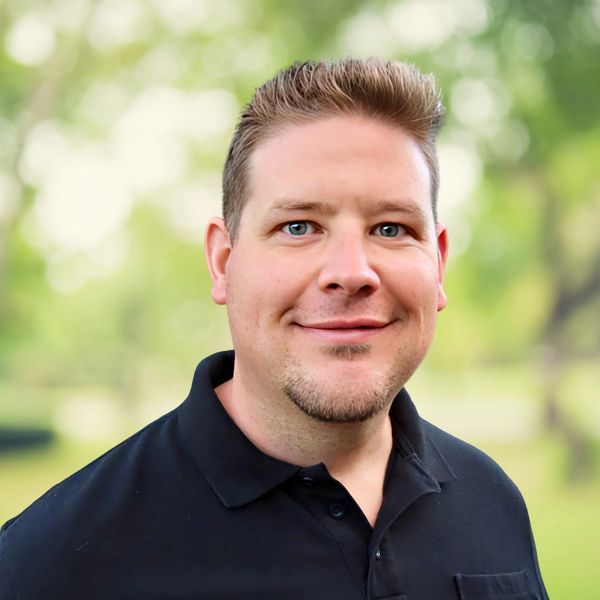 Nick Worstell, Licensed Professional Counselor at Empathic Insights Therapy, smiling warmly against a clean, neutral background. The image reflects a compassionate and empowering approach to Counseling Services and Dialectical Behavioral Therapy (DBT), conveying trust, warmth, and support for clients seeking meaningful change and personal growth.