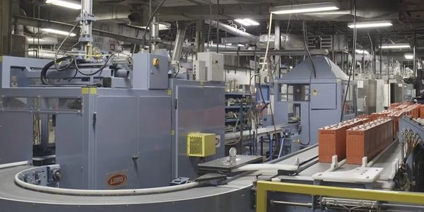 Industrial machinery operating in a factory setting with conveyor belts.