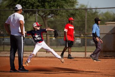 Head Coach Christian Lara working to develop a Play Pro Baseball pitcher.