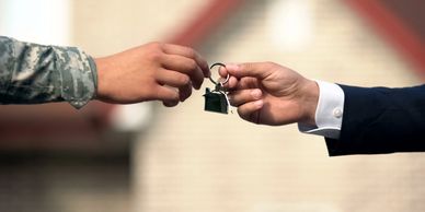 Veteran receiving the keys to a home