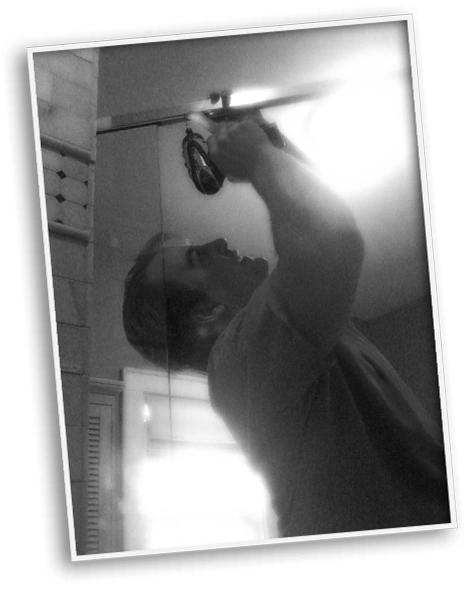 Scott Lappen installing a shower door for a client.