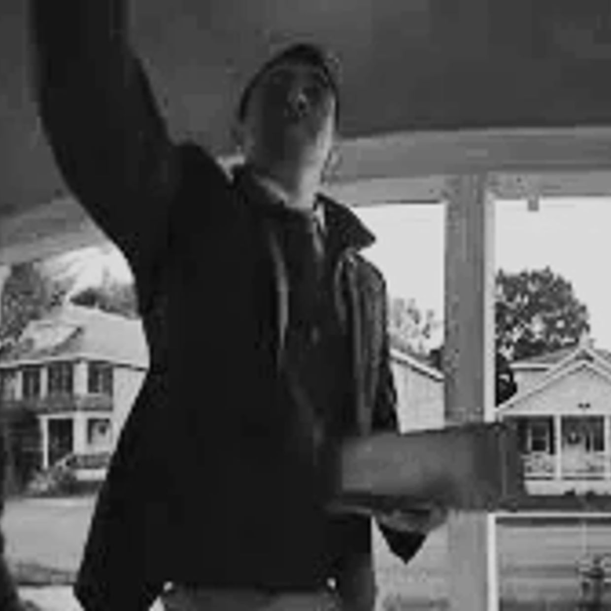 A person delivering a package at the doorstep.