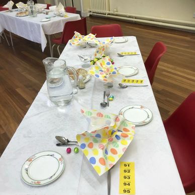 Photo of a set table for 'PAC Welcome Lunches'.