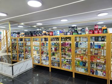 Well-lit store shelves displaying various health and beauty products.