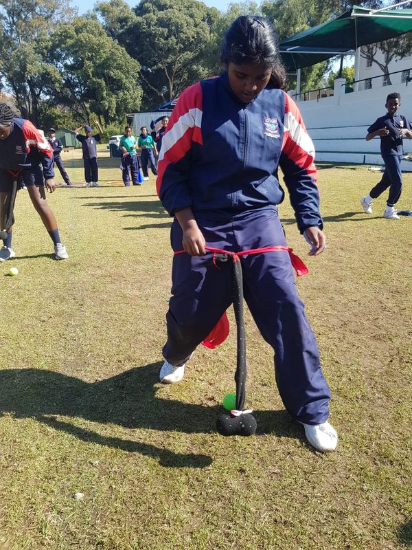 Girl playing a fun outdoor team game with a sock and ball.