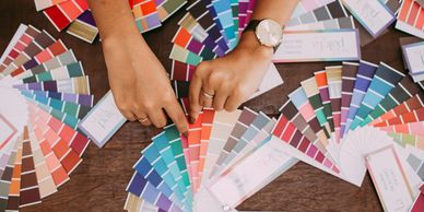 a picture of someone viewing multiple color palate wheels