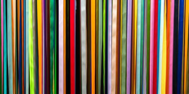 a picture of multiple colors of fabrics stacked together