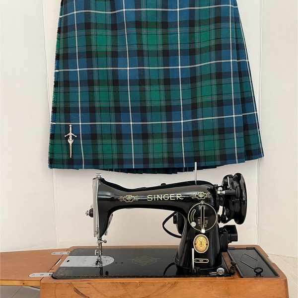 Traditional black sewing machine used to make kilts