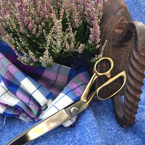 Flowers and kilt material on a table