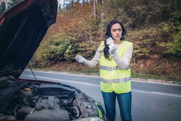 Woman with broken down vehicle