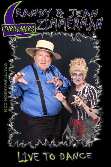 Brandy and Jean Zimmerman dressed as Thrillagers, posing with clawed hands.