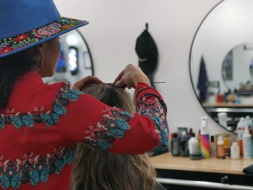 Men’s haircuts, shaves, color, highlights, women’s haircuts, and facials — she does it all!