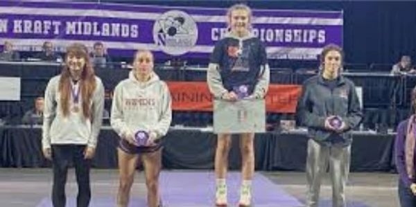 Carley Chesker wins High School Wrestling and college wrestling tournaments.  Wrestling camps
