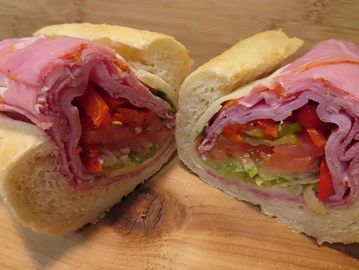Sandwich halves with meat and vegetables