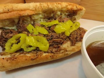 A sandwich with meat and vegetables