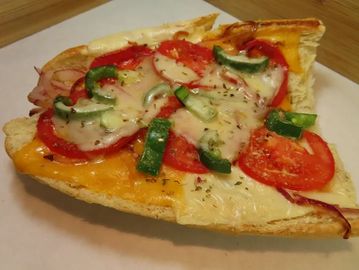 A sandwich with cheese and vegetables
