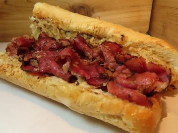 A sandwich with slices of meat