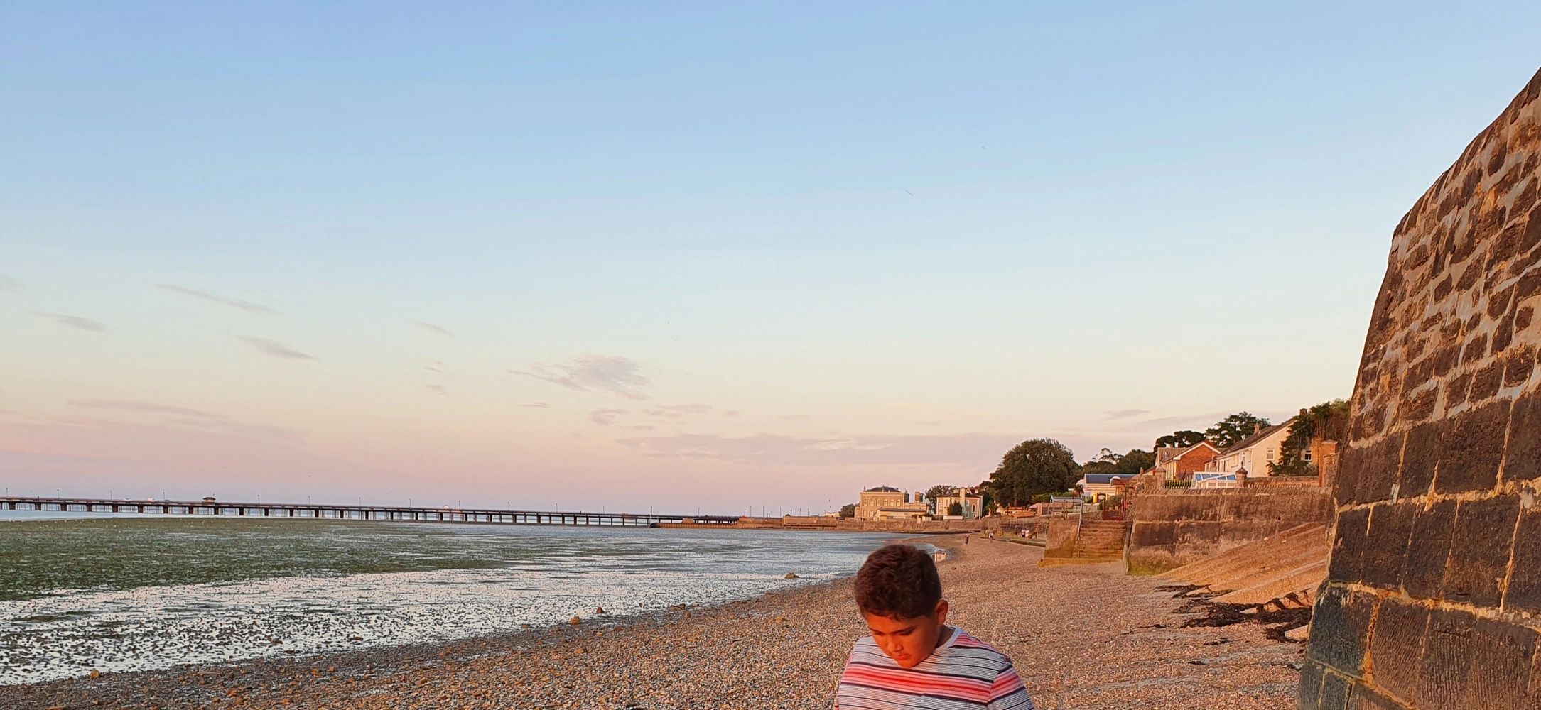 Enjoying a beach walk at sunset.