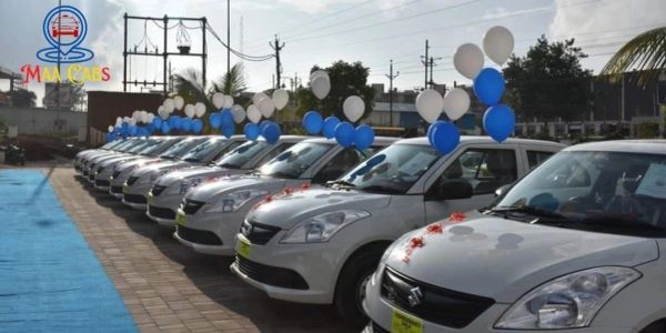 Line of decorated white cars with blue and white balloons.
