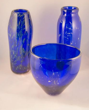 Blown class pieces colored dark blue and embedded with sterling silver