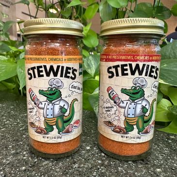Two jars of Stewie's seasoning with an alligator chef on the label.