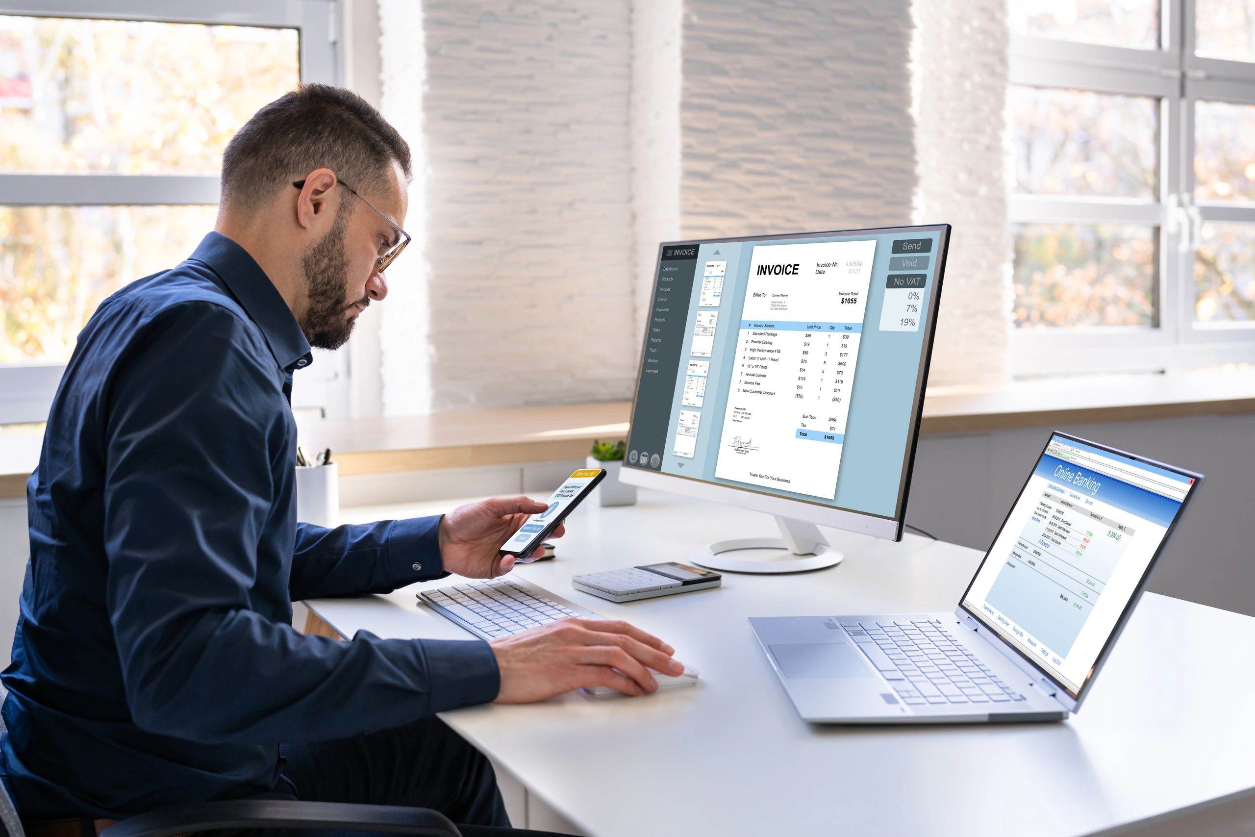 Young Businessman Looking At Invoice While Doing Online Banking