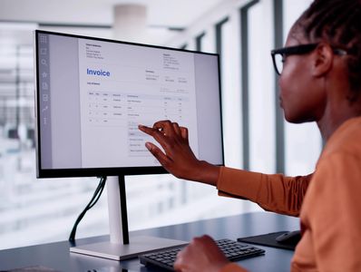 Bookkeeper reviewing invoice automatically lodged through FastBills