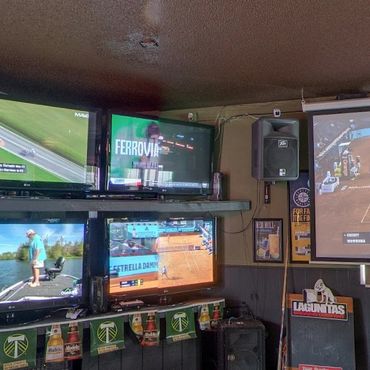 Large TV wall showing sports at Greeley Avenue sports bar North Portland