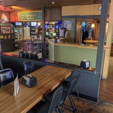 Cozy pub interior with Oregon Lottery games and big-screen TVs at Greeley Avenue