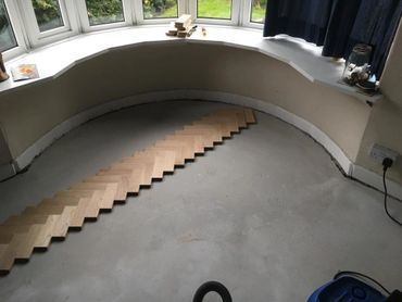 The start of a new installation of parquet flooring