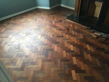 Mahogany parquet floor after years of use