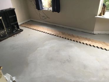 The start of a new installation of parquet flooring