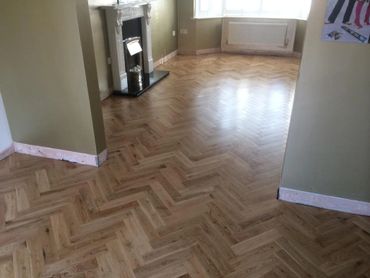 Installed and sanded, here is the herringbone parquet flooring we completed in Rhyl