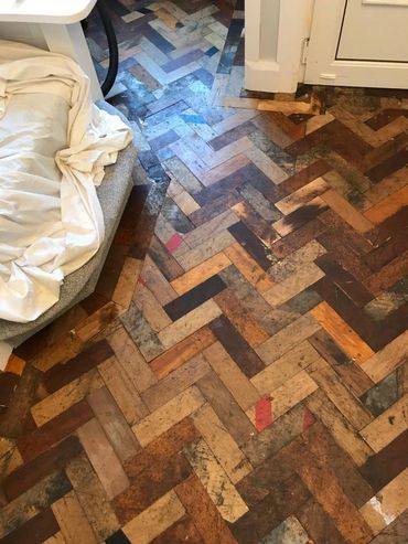 The installation of the reclaimed wood parquet floor is now complete