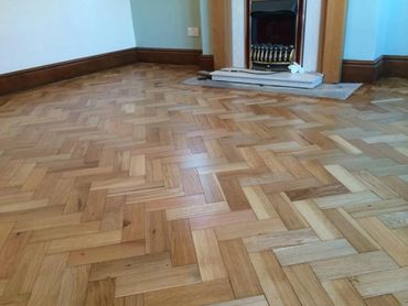Fitted and lacquered wooden block flooring