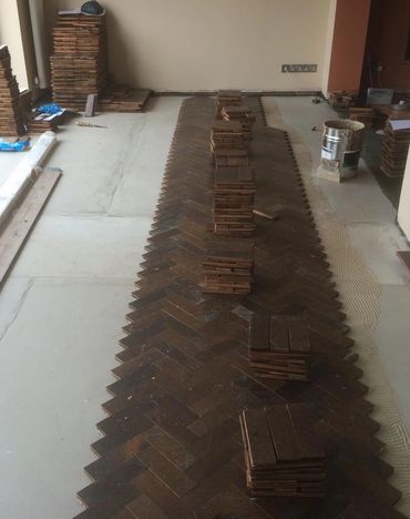 The start of a reclaimed hardwood floor parquet floor installation in Wirral