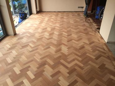 Fully sanded parquet wood floor using reclaimed mahogany wood