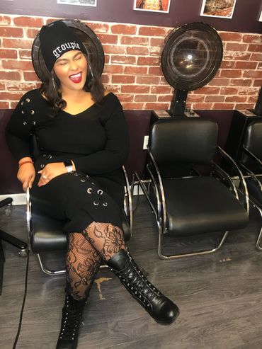 Black Girl Magic. Chilling in the hair salon in Brooklyn