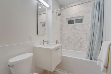 Bathroom remodel with marble hexagon tiles, floating vanity