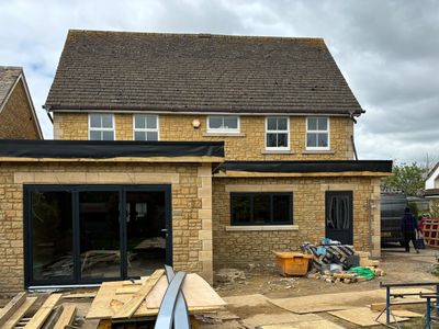 Anthracite Grey Aluminium Bi-fold and windows installed by Eco Windows