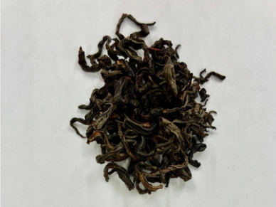 Dried loose leaf tea on white background.